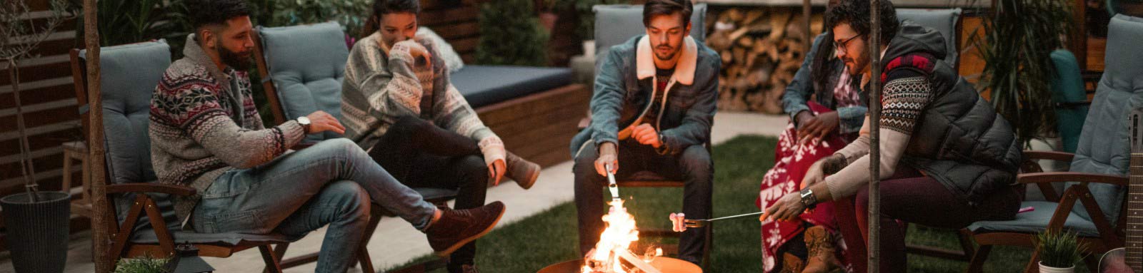 Friends sitting around a fire