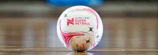 Netball on the floor of an indoor court