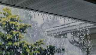 Rain falling from rooftop