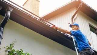 Man cleaning rooftop