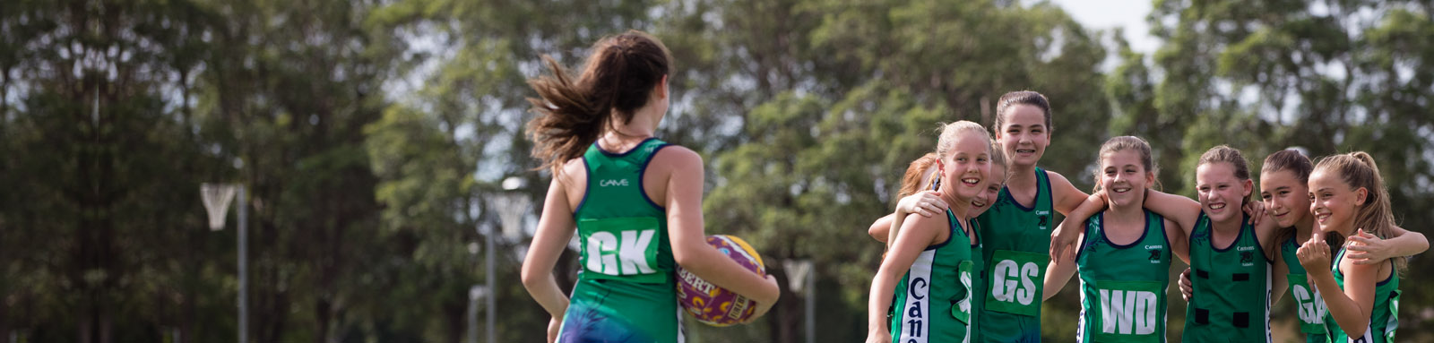 Young netball players open huddle