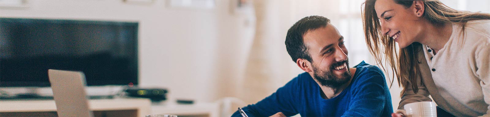 Couple Checking Finances With Laptop