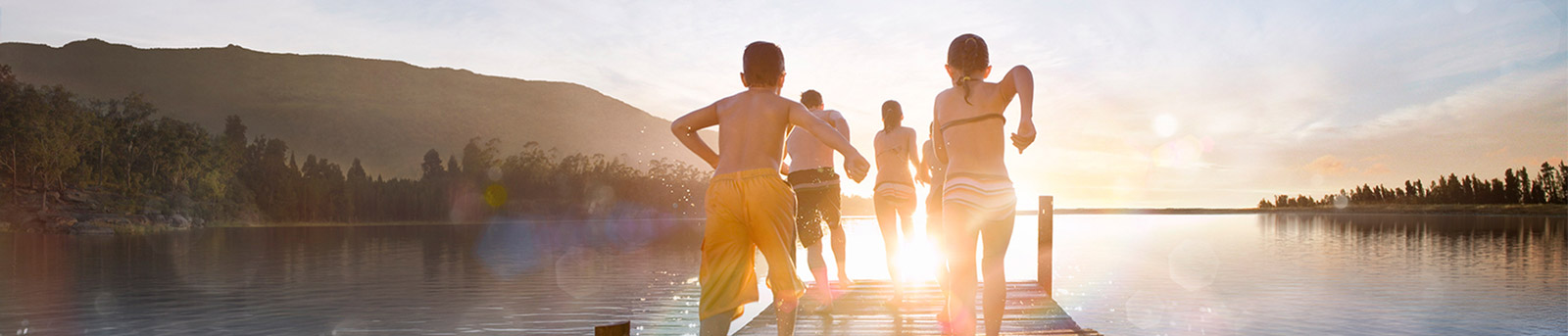 Kids Running towards water during sunset 