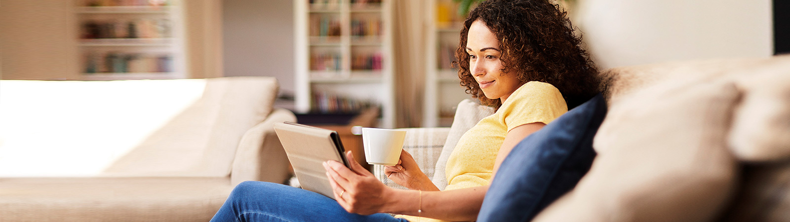 Woman reading on sofa