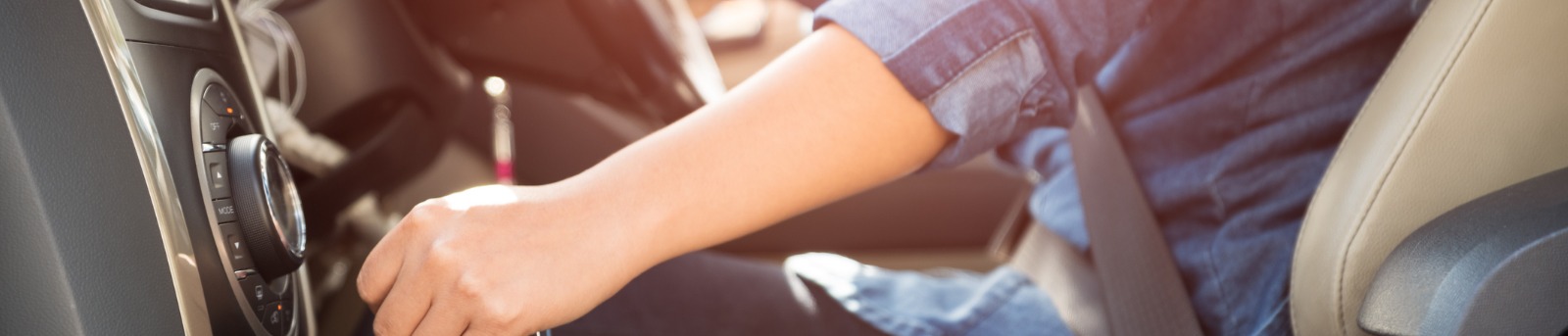 Female driver shifting gear stick