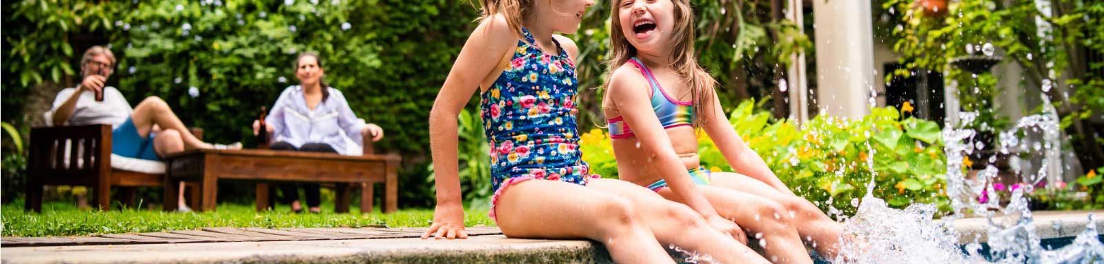 Family relaxing by the pool