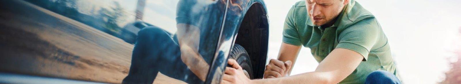 Man chaning a tyre