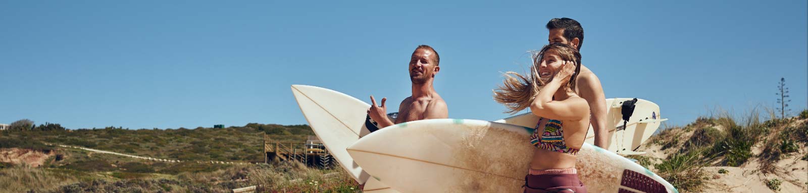 Surfers walking on the beach