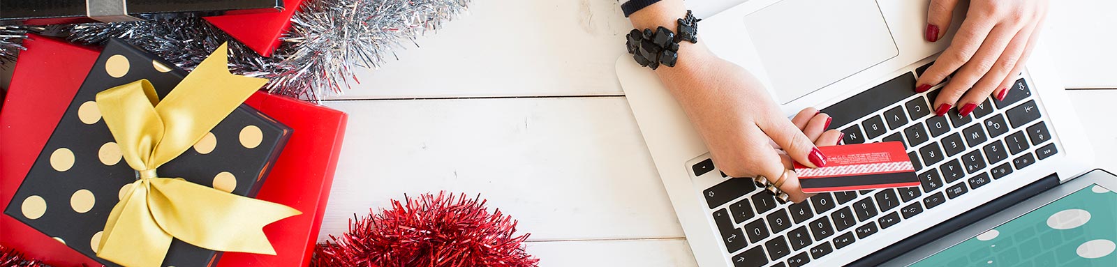 Woman doing Christmas shopping in a decorated home