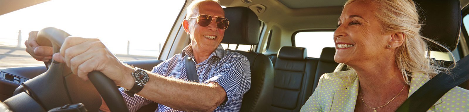 Senior Couple Driving in a Car