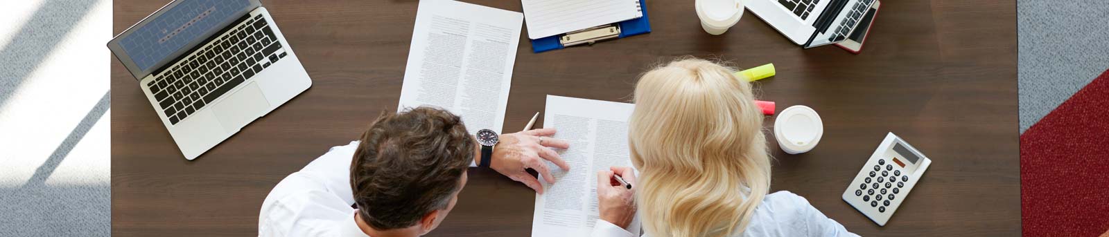 Man and woman explaining mortgage documents