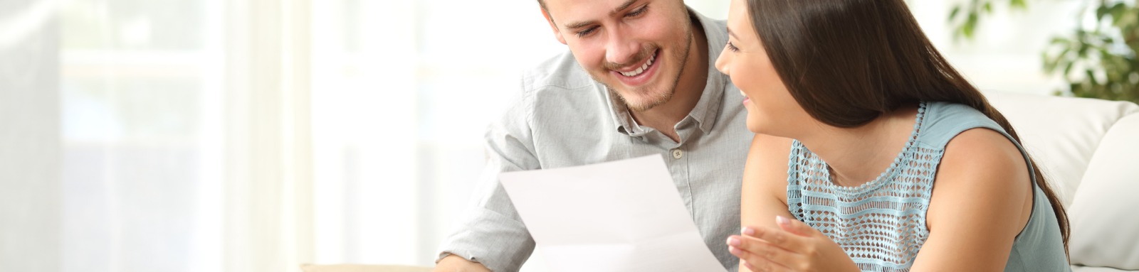 Man and woman reading a document