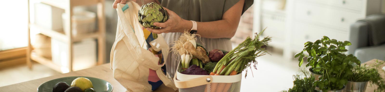 Woman holding artichoke