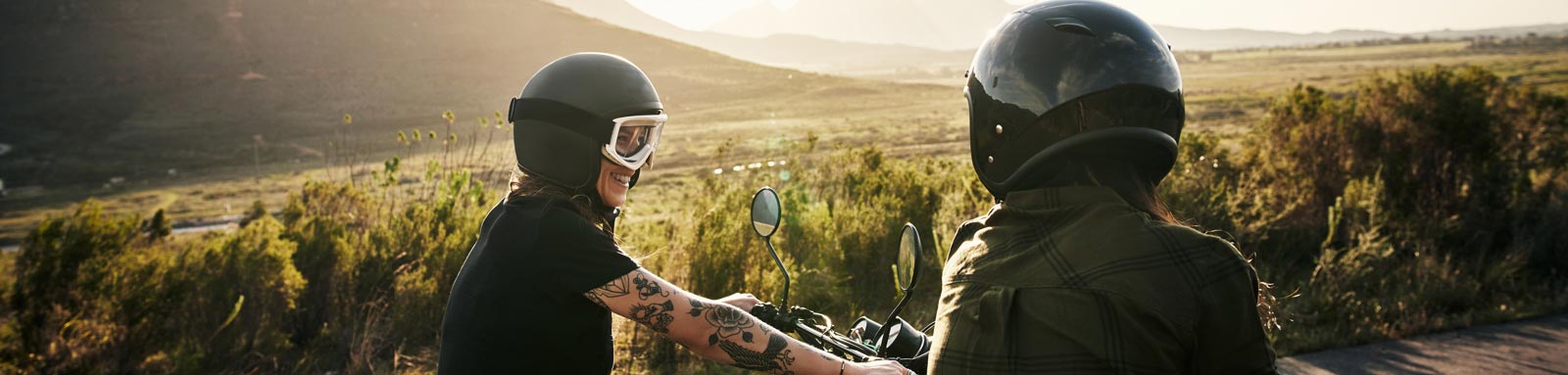 Couple riding motorbikes