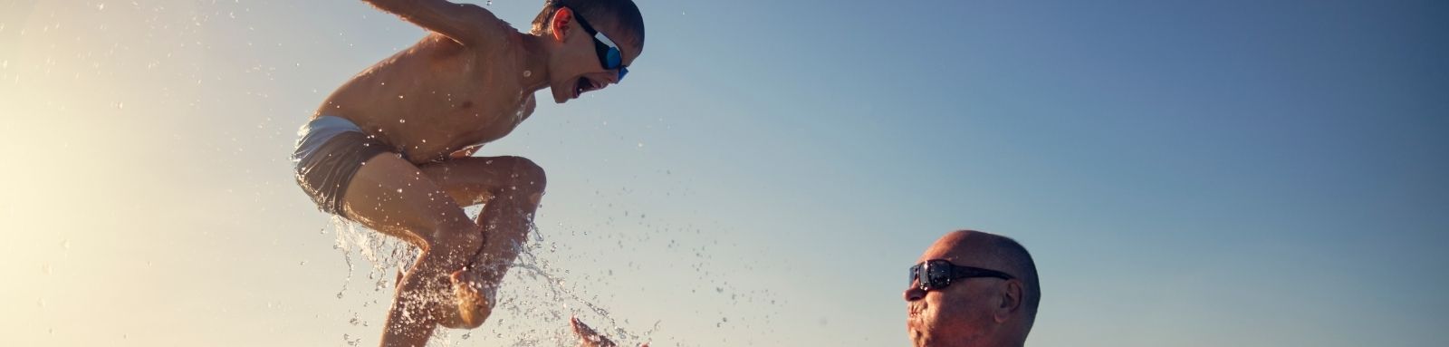 Father and son in the ocean