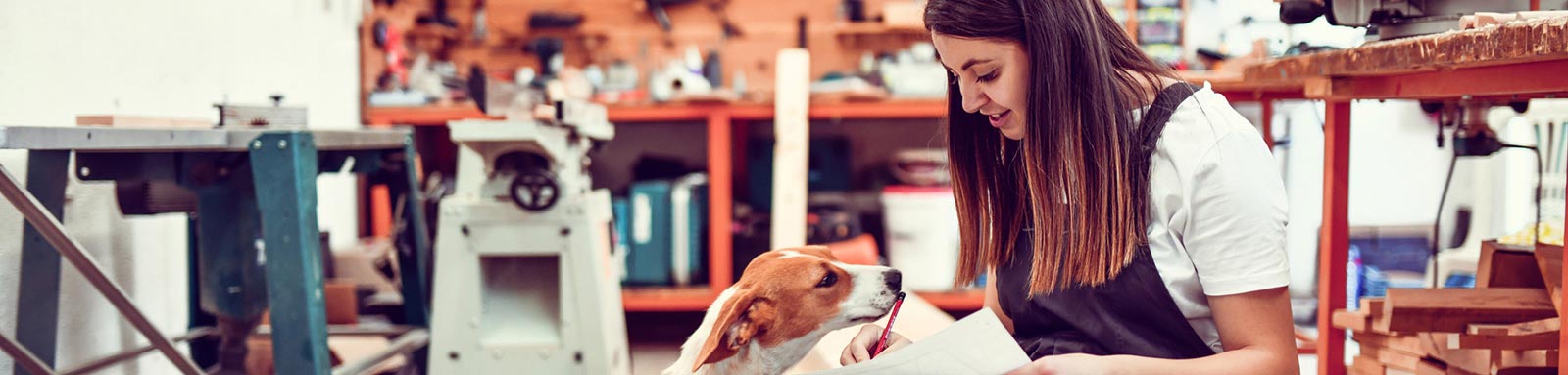 Female in workroom with dog