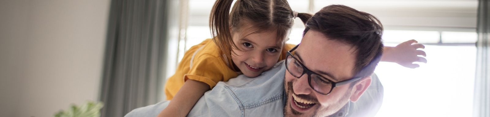 Girl on dad's back