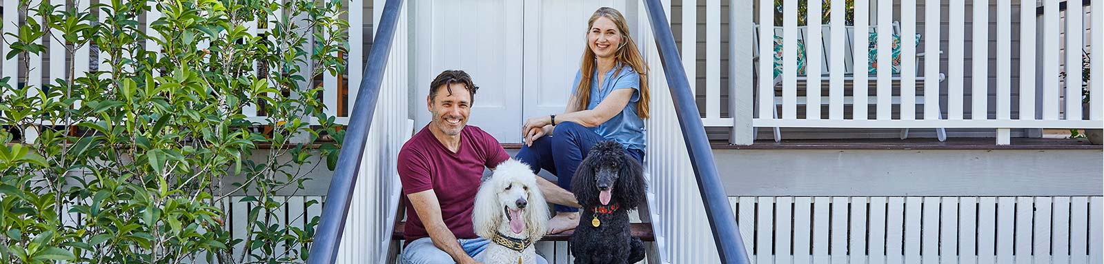 Couple on stairs with dog