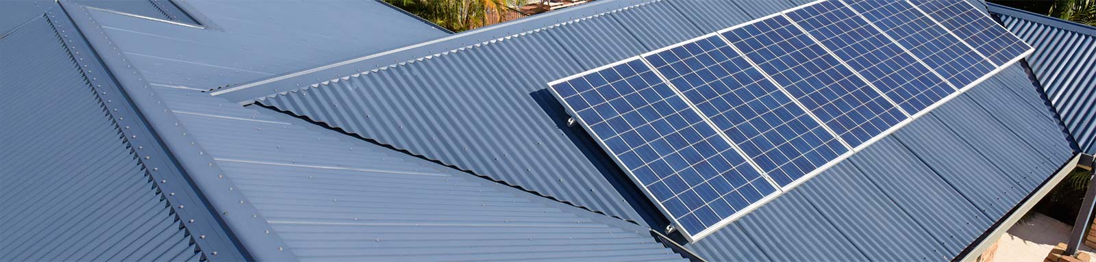 Rows of Solar panels on a house roof.