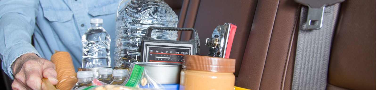 senior man prepares for roadside emergency