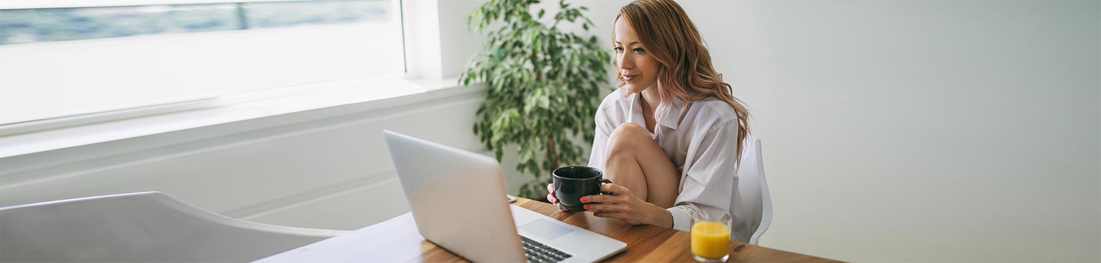 Woman at home working on laptop