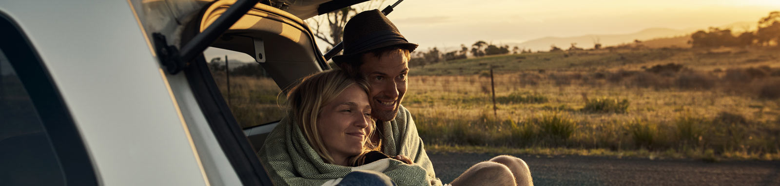 Couple in back of car