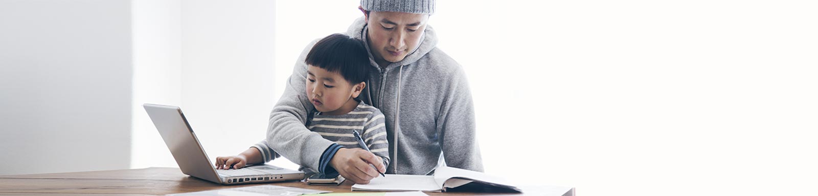 Father and son working at home