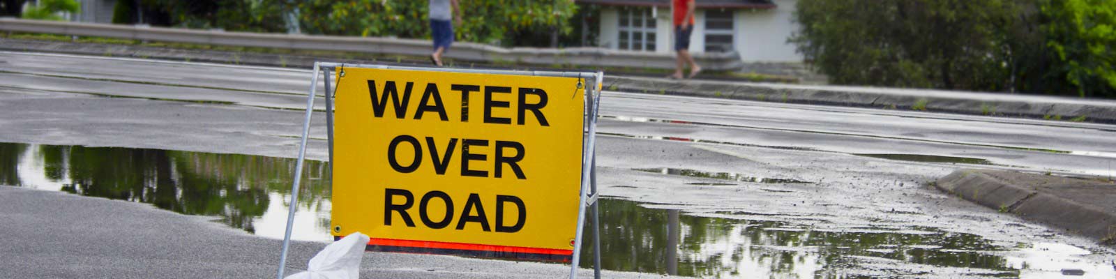 Water over road sign