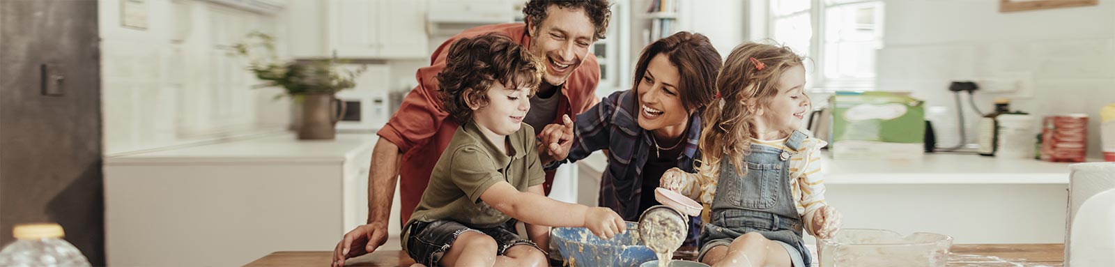 Young couple baking with children