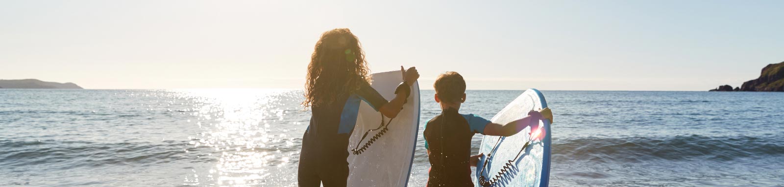 Kids with bodyboards at the beach