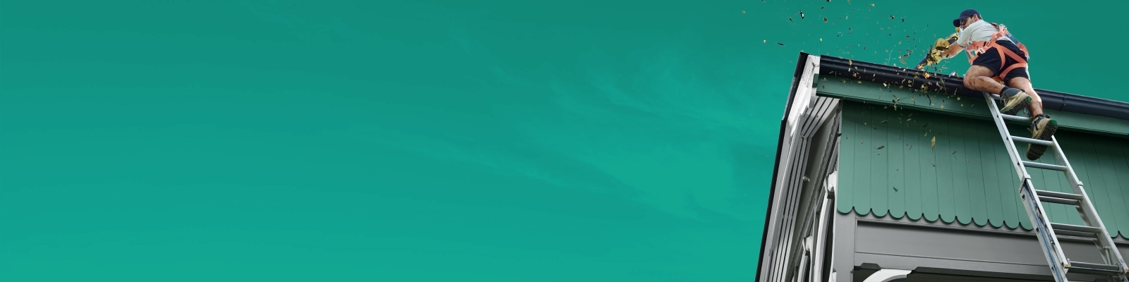 a man cleaning house gutters on ladder