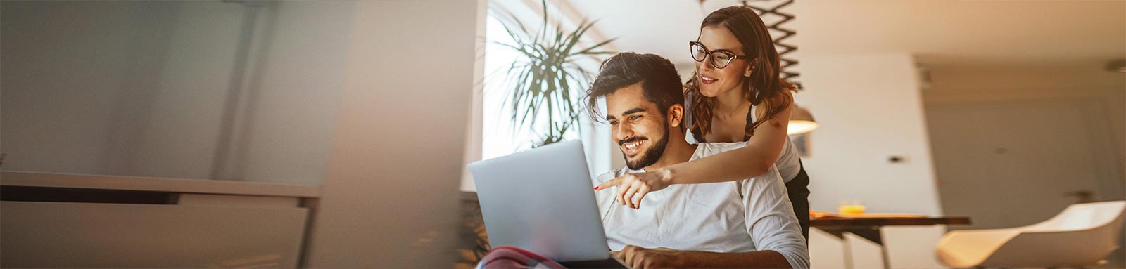 Man and woman looking at laptop