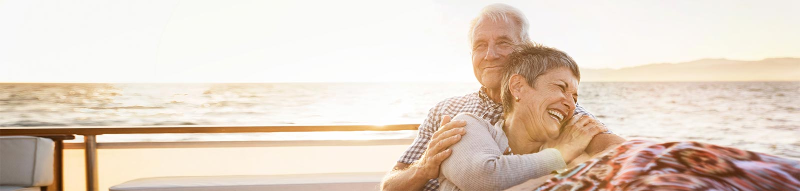 Man and woman smiling on a boat