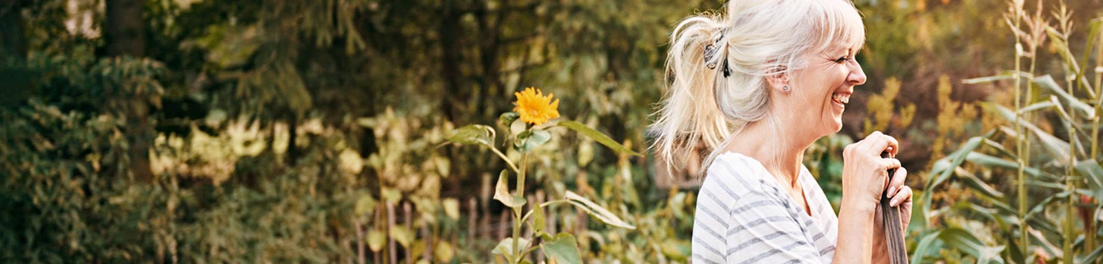 Woman gardening and smiling