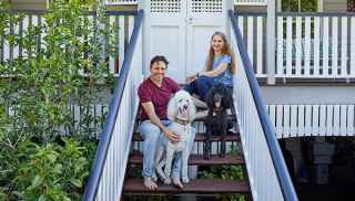 Couple on stairs with dog