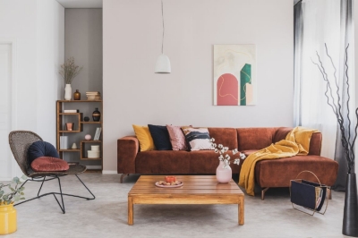 Velvet orange red sofa in the living room