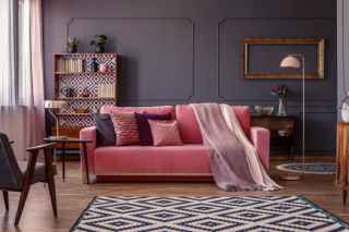 Pastel pink couch in lounge room
