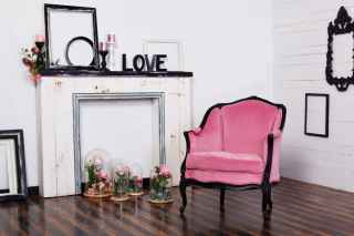 Pink chair on wooden floorboards