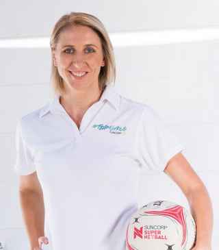 Claire Ferguson holding a netball